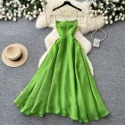 Green Backless Maxi Dress for Women with Waist Cinching Design and Flared Skirt Ideal for Summer Vacations Wholesale