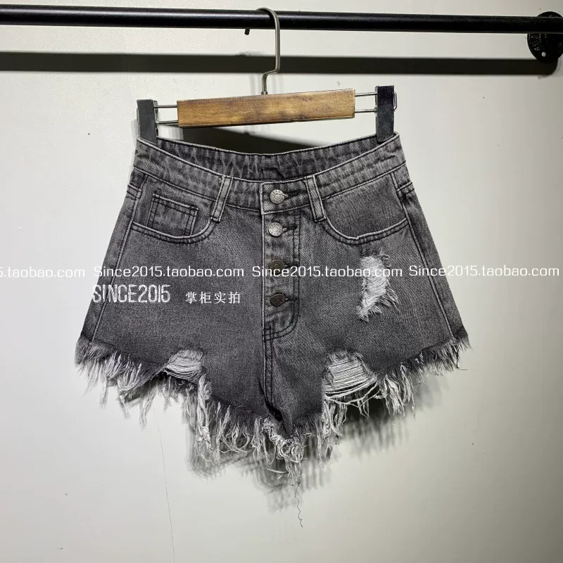 夏季新款高腰破洞排扣牛仔短裤女宽松显瘦A字性感热裤毛边阔腿裤